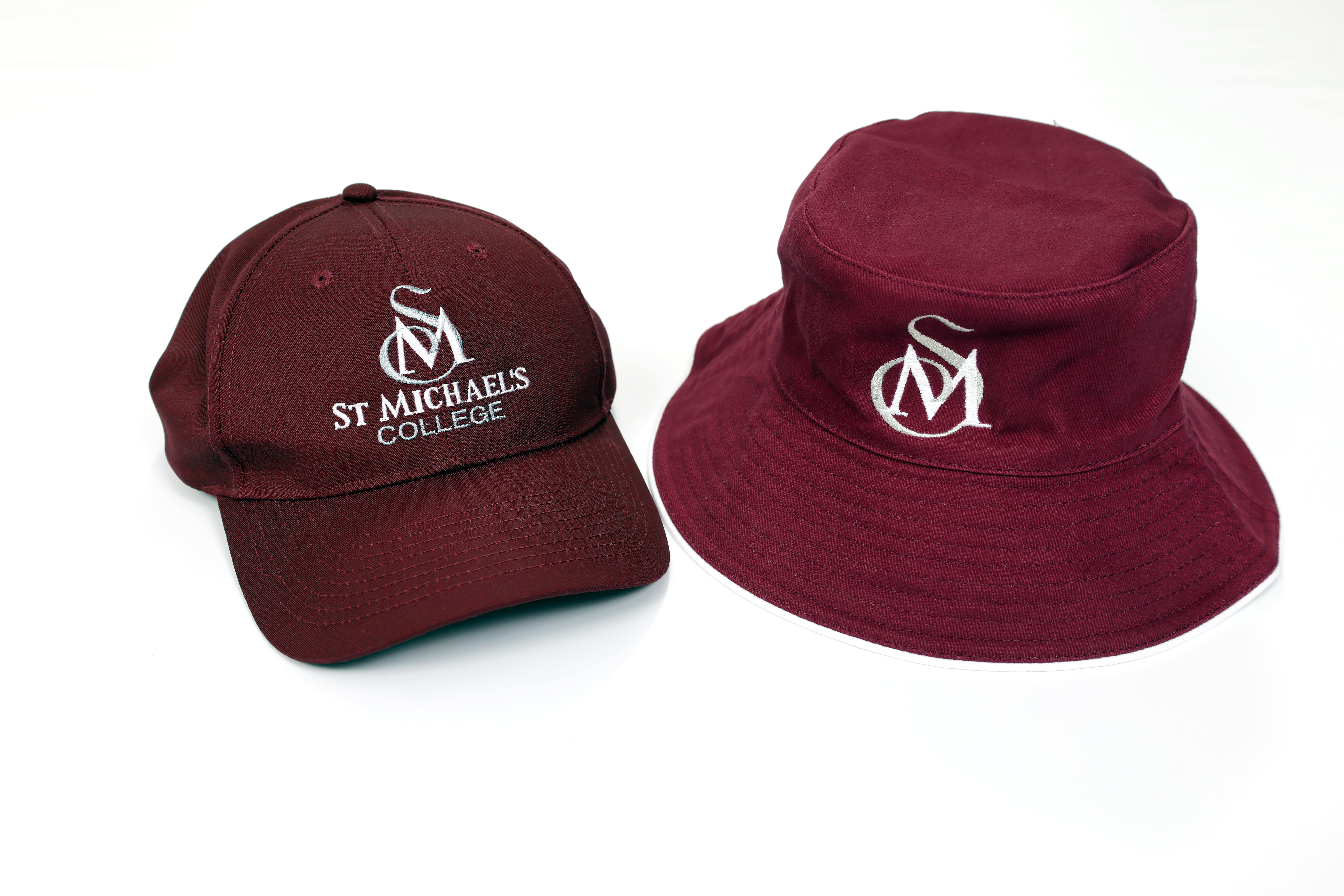 Maroon St Michael’s College cap and bucket hat featuring embroidered school logo